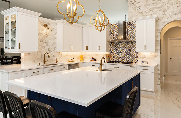 A kitchen with white marble counters that has been professionally cleaned by Aladdin Cleaning and Restoration