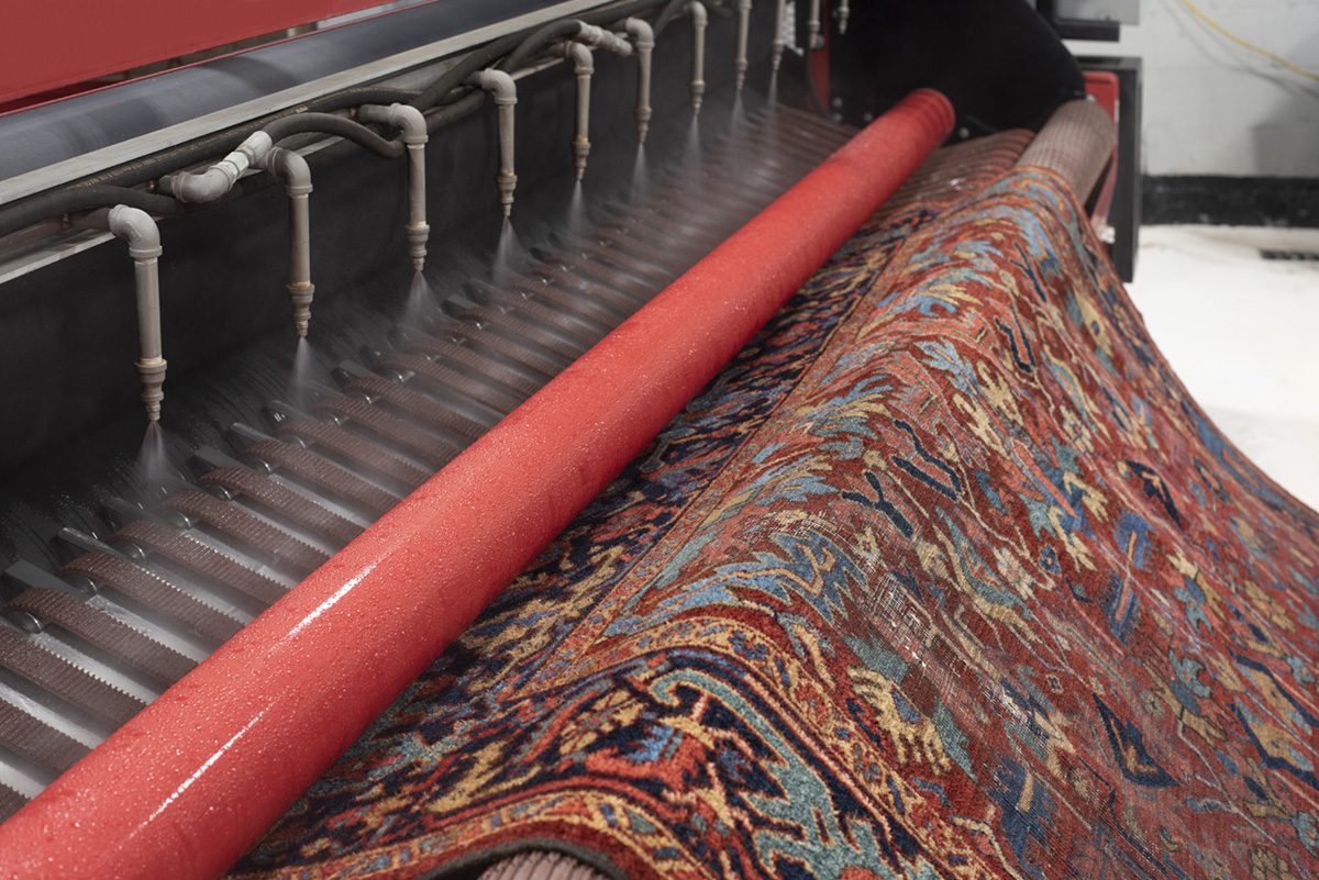 Professional machine cleaning applies detergent, gentle agitation and thoroughly rinses soil and detergent from oriental rug