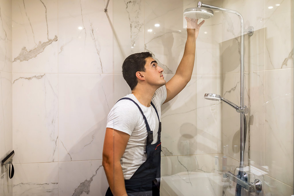 contractor inside marble shower