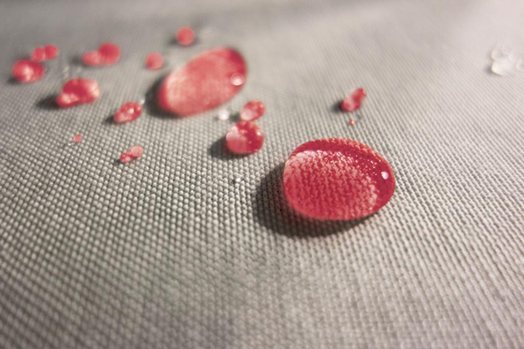 Professional fabric protection applied protecting upholstery on couch from liquids and stains