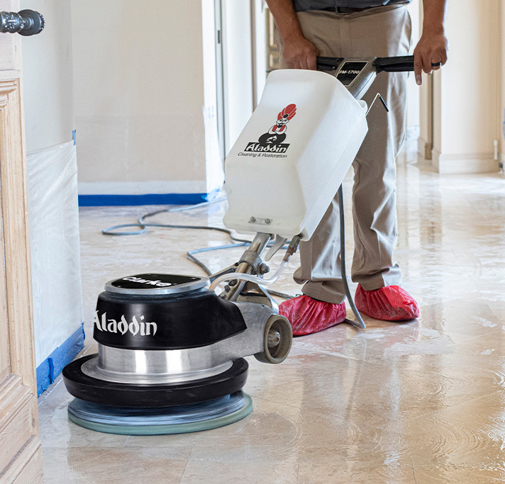 Aladdin cleaning specialist professionally cleaning tile, grout and stone in a home