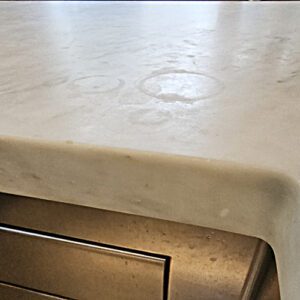 What is etching damage on natural stone like marble