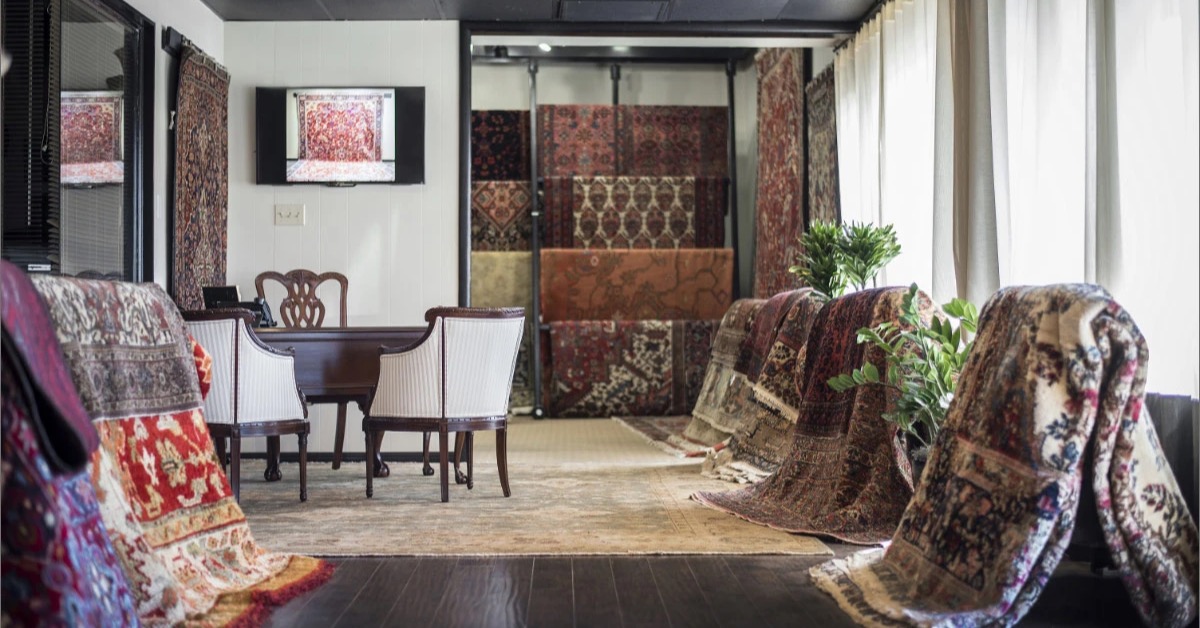 Several Oriental and antique rugs displayed inside Aladdin’s San Antonio Rug Gallery